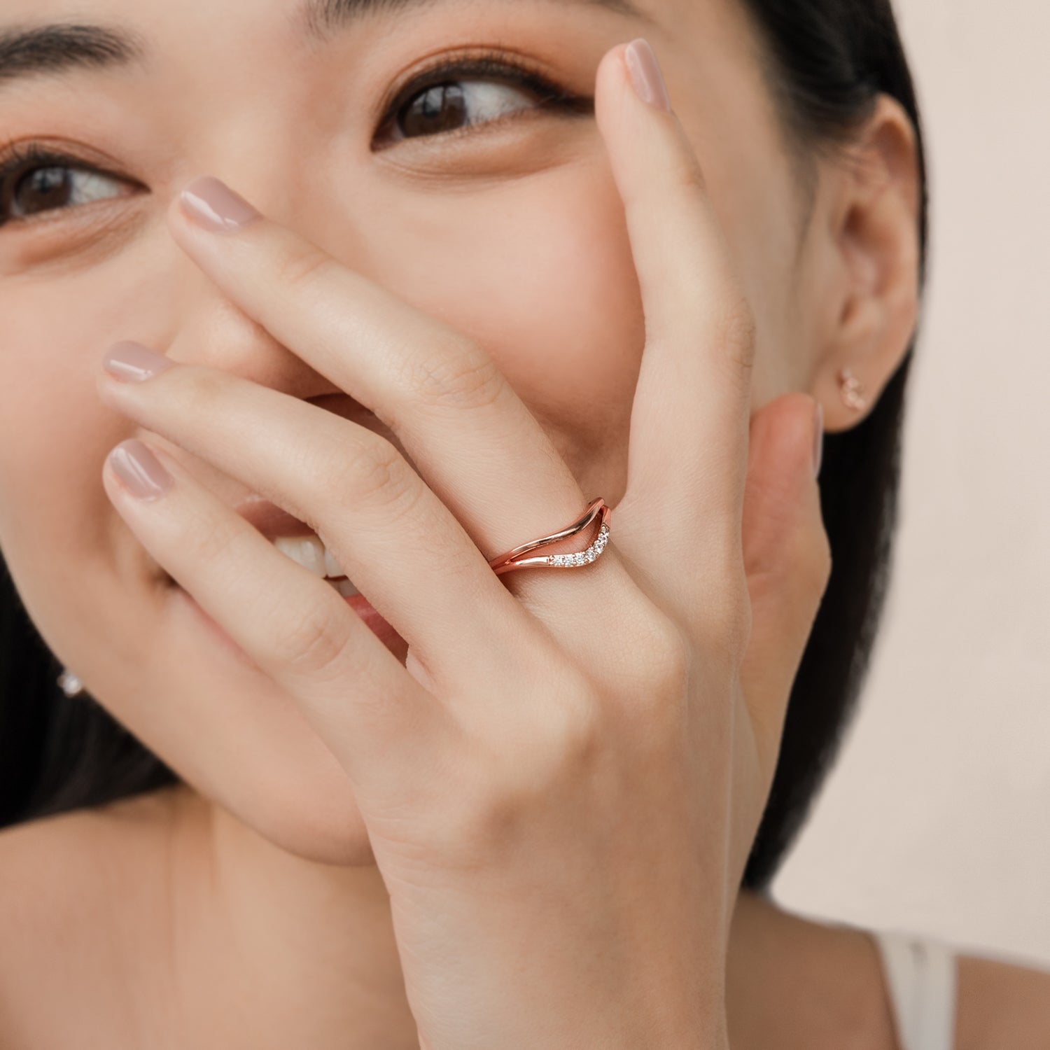 Elegant and minimalist ring. Model wears rose gold double ring set with cubic zircona stones